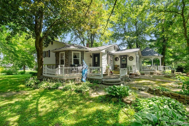 3439 N Mill Rd, Dryden, MI 48428 - back of house featuring a gazebo, a yard, and a wooden deck