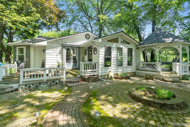 3439 N Mill Rd, Dryden, MI 48428 - view of front facade with a gazebo and a deck