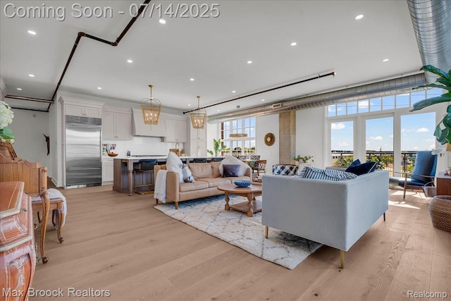 2051 Villa Rd Unit 302, Birmingham, MI 48009 - living area with light wood-style flooring and recessed lighting