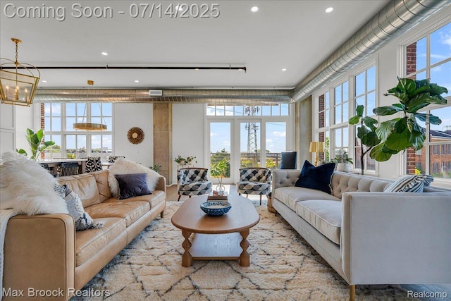 2051 Villa Rd Unit 302, Birmingham, MI 48009 - living area featuring plenty of natural light, recessed lighting, and a chandelier