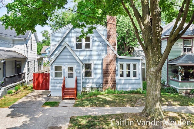 1340 Ashland Ave NE, Grand Rapids, MI 49505 - view of front of house with entry steps and a chimney
