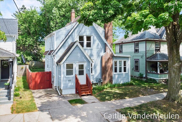 1340 Ashland Ave NE, Grand Rapids, MI 49505 - view of front of property with entry steps and a chimney