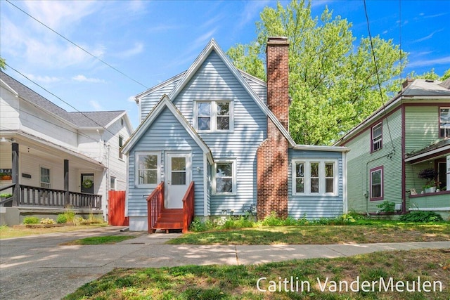 1340 Ashland Ave NE, Grand Rapids, MI 49505 - view of front facade featuring a chimney and entry steps