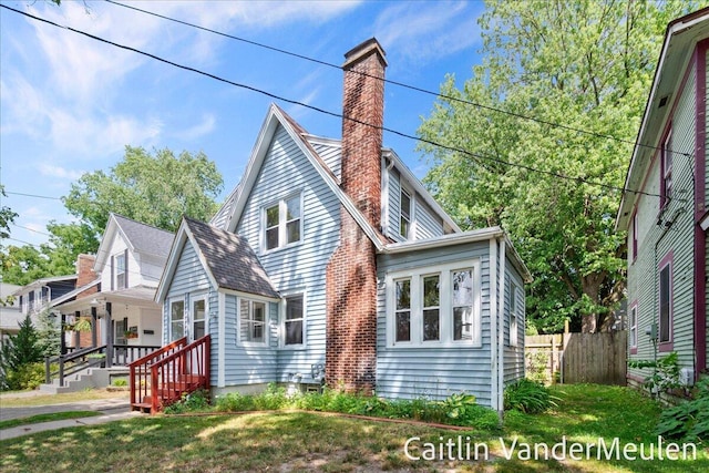 1340 Ashland Ave NE, Grand Rapids, MI 49505 - view of front facade with a chimney