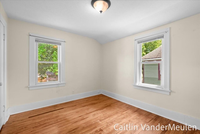 1340 Ashland Ave NE, Grand Rapids, MI 49505 - unfurnished room featuring wood finished floors and lofted ceiling