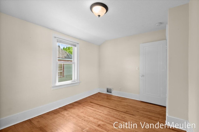 1340 Ashland Ave NE, Grand Rapids, MI 49505 - unfurnished room featuring wood finished floors and a smoke detector
