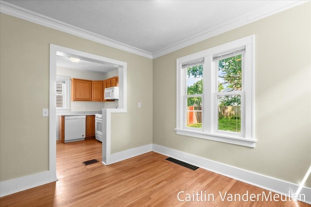 1340 Ashland Ave NE, Grand Rapids, MI 49505 - unfurnished room featuring light wood finished floors and ornamental molding
