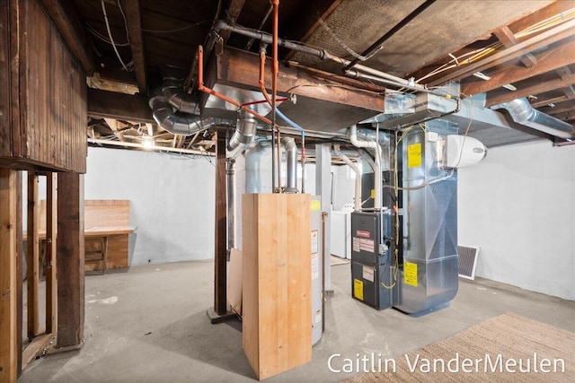 1340 Ashland Ave NE, Grand Rapids, MI 49505 - unfinished below grade area with heating unit and washer / clothes dryer
