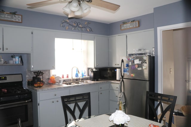 1122 Aberdeen St NE, Grand Rapids, MI 49505 - kitchen with stainless steel appliances and ceiling fan