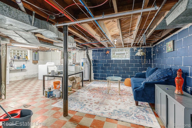 35451 John St, Wayne, MI 48184 - below grade area featuring washing machine and clothes dryer, water heater, tile patterned floors, and electric panel