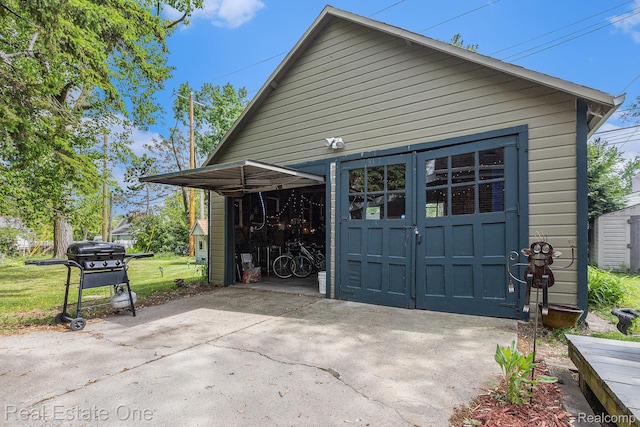 35451 John St, Wayne, MI 48184 - view of property exterior with an outbuilding and a garage