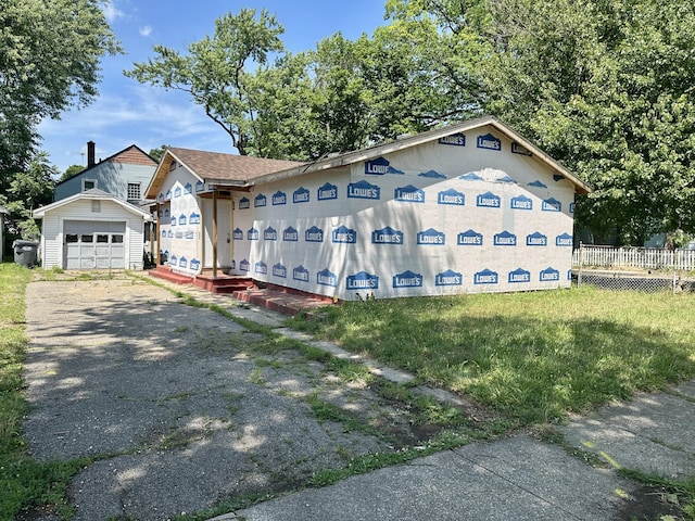1820 Elgin St, Kalamazoo, MI 49001 - property under construction featuring an outbuilding, asphalt driveway, and a garage