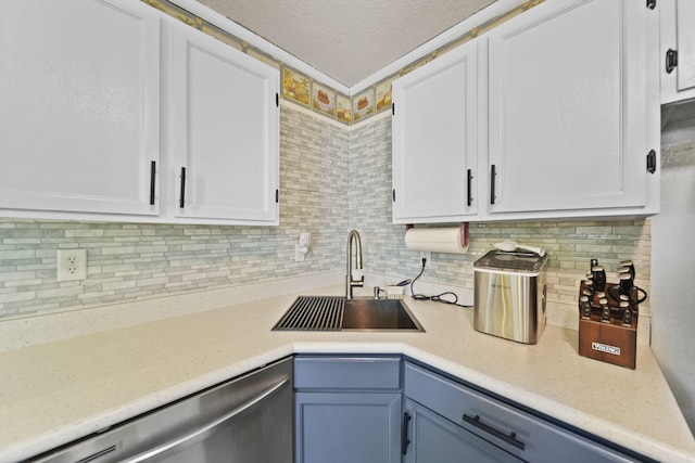 350 N Horton St, Jackson, MI 49202 - kitchen with dishwasher, light countertops, white cabinetry, backsplash, and a textured ceiling