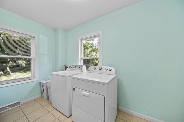 350 N Horton St, Jackson, MI 49202 - laundry area with washing machine and dryer and light tile patterned floors