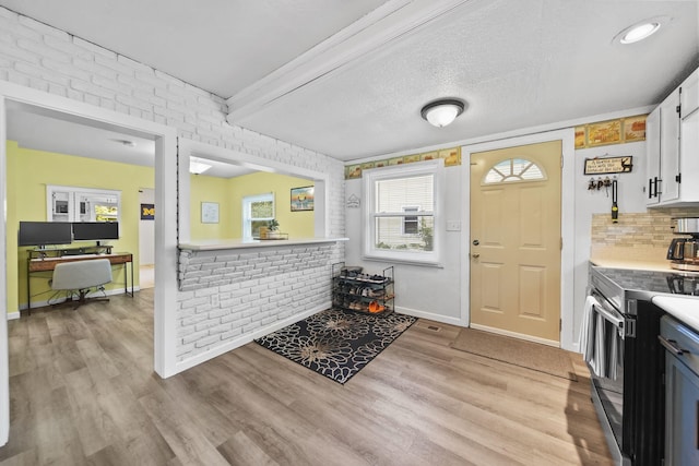 350 N Horton St, Jackson, MI 49202 - entryway featuring light wood-style flooring and healthy amount of natural light