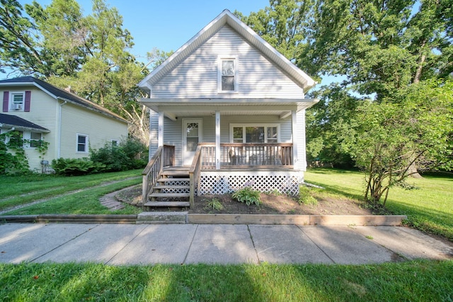 350 N Horton St, Jackson, MI 49202 - view of front of home with covered porch and a front lawn