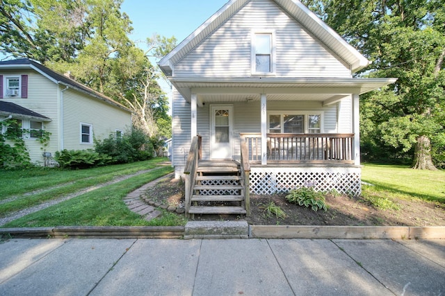 350 N Horton St, Jackson, MI 49202 - bungalow-style home featuring a porch and a front yard
