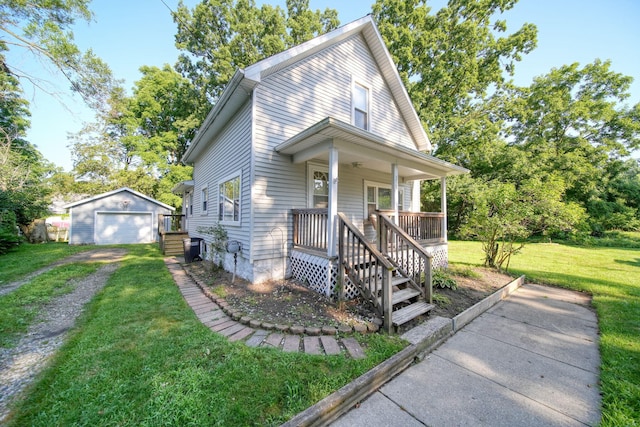 350 N Horton St, Jackson, MI 49202 - view of front of home with a detached garage, an outbuilding, a front lawn, a porch, and driveway