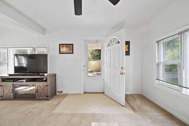 350 N Horton St, Jackson, MI 49202 - carpeted foyer entrance with a ceiling fan and baseboards