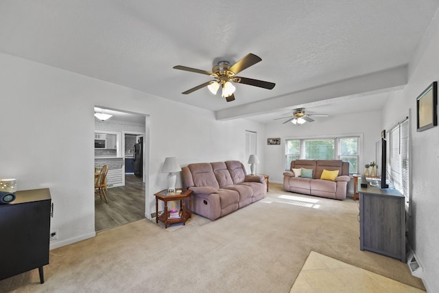 350 N Horton St, Jackson, MI 49202 - carpeted living area with a ceiling fan and baseboards