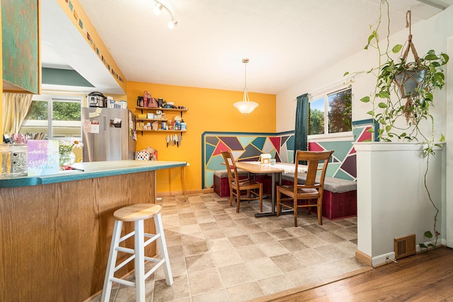 471 Dupont Ave, Ypsilanti, MI 48197 - dining space with baseboards and bar
