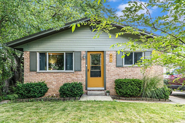 471 Dupont Ave, Ypsilanti, MI 48197 - view of front facade with a front lawn and brick siding