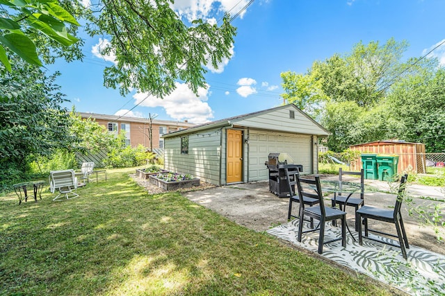 471 Dupont Ave, Ypsilanti, MI 48197 - view of grassy yard featuring an outbuilding and a detached garage