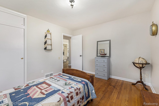 23306 Greencrest St, Saint Clair Shores, MI 48080 - bedroom with wood finished floors and baseboards
