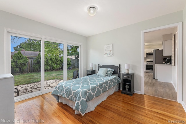 23306 Greencrest St, Saint Clair Shores, MI 48080 - bedroom featuring access to outside and light wood-type flooring