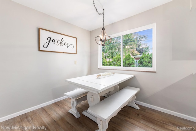 23306 Greencrest St, Saint Clair Shores, MI 48080 - dining room with wood finished floors and a chandelier