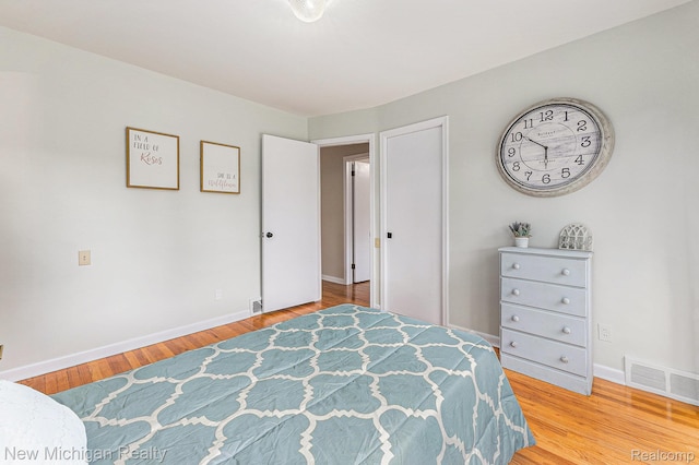23306 Greencrest St, Saint Clair Shores, MI 48080 - bedroom featuring baseboards and light wood-style floors