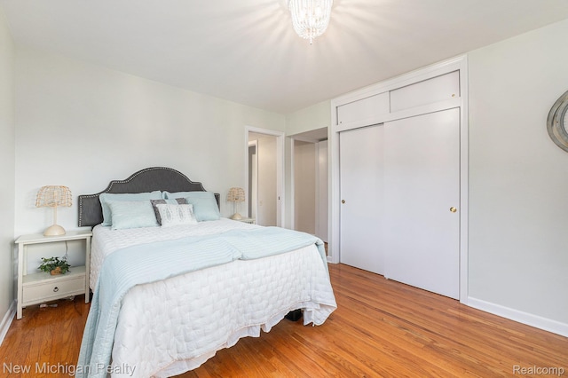 23306 Greencrest St, Saint Clair Shores, MI 48080 - bedroom featuring light wood-type flooring and a closet