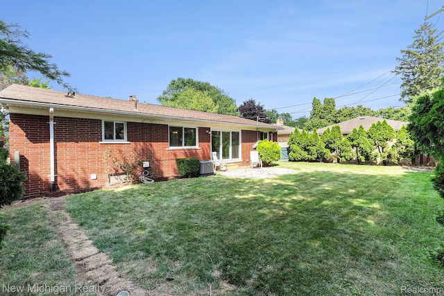 23306 Greencrest St, Saint Clair Shores, MI 48080 - back of house with brick siding, a yard, and a patio