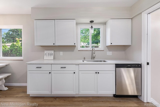 23306 Greencrest St, Saint Clair Shores, MI 48080 - kitchen with dishwasher, white cabinets, plenty of natural light, and light countertops