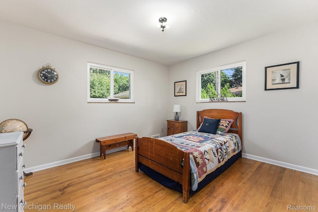 23306 Greencrest St, Saint Clair Shores, MI 48080 - bedroom featuring multiple windows and light wood-style flooring