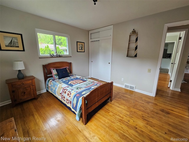 23306 Greencrest St, Saint Clair Shores, MI 48080 - bedroom with hardwood / wood-style flooring and a closet