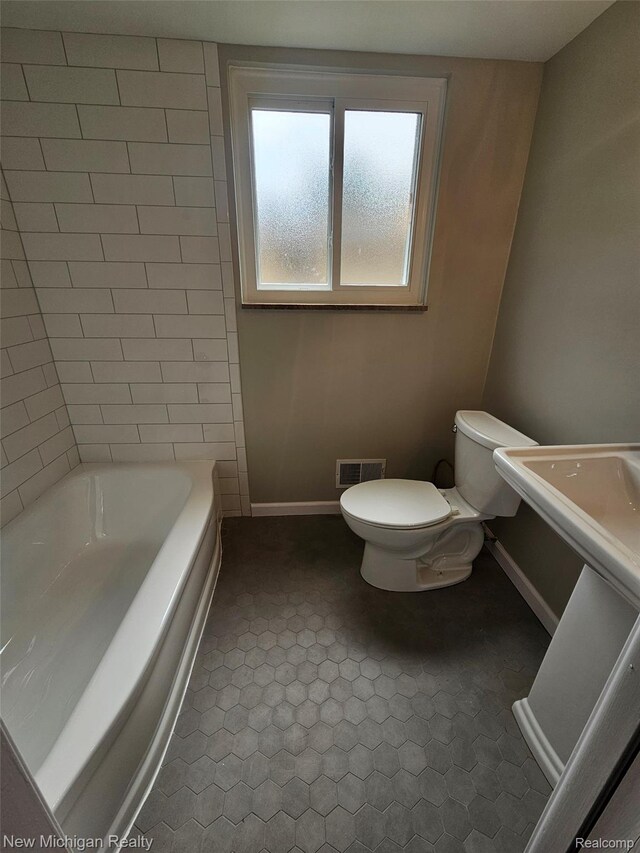 23306 Greencrest St, Saint Clair Shores, MI 48080 - bathroom featuring a tub to relax in and toilet