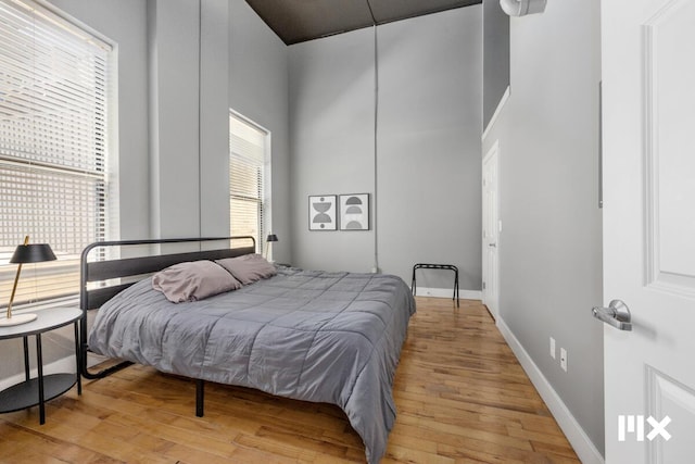 139 Pearl St NW, Grand Rapids, MI 49503 - bedroom featuring light wood-style floors and a towering ceiling