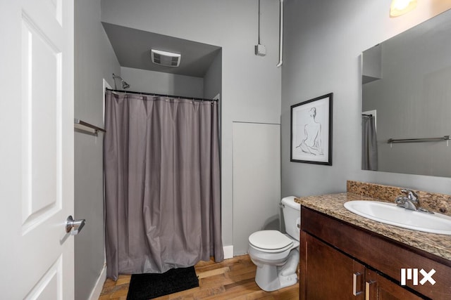 139 Pearl St NW, Grand Rapids, MI 49503 - bathroom with vanity, wood finished floors, and a shower with curtain