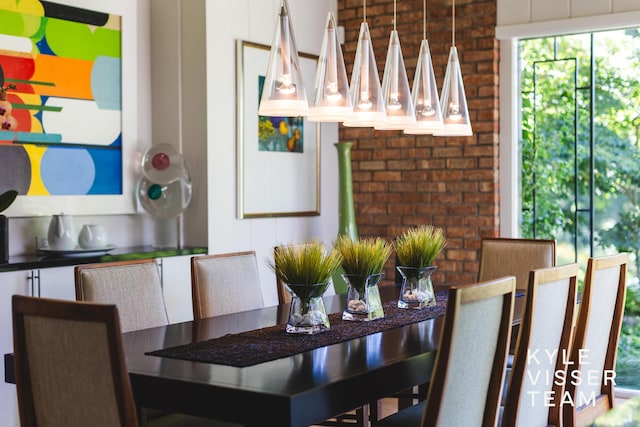130 Robinwood Ave SE, Grand Rapids, MI 49506 - dining room featuring brick wall