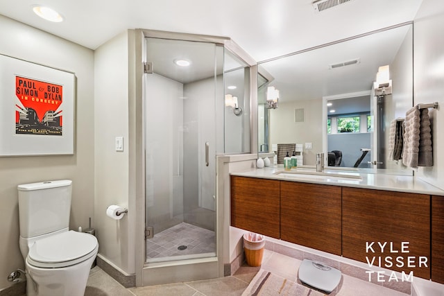 130 Robinwood Ave SE, Grand Rapids, MI 49506 - full bathroom featuring vanity, a shower stall, and tile patterned floors