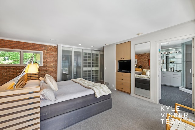 130 Robinwood Ave SE, Grand Rapids, MI 49506 - carpeted bedroom featuring brick wall