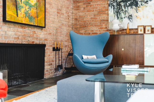 130 Robinwood Ave SE, Grand Rapids, MI 49506 - sitting room with a fireplace and brick wall