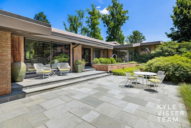 130 Robinwood Ave SE, Grand Rapids, MI 49506 - view of patio featuring outdoor dining area