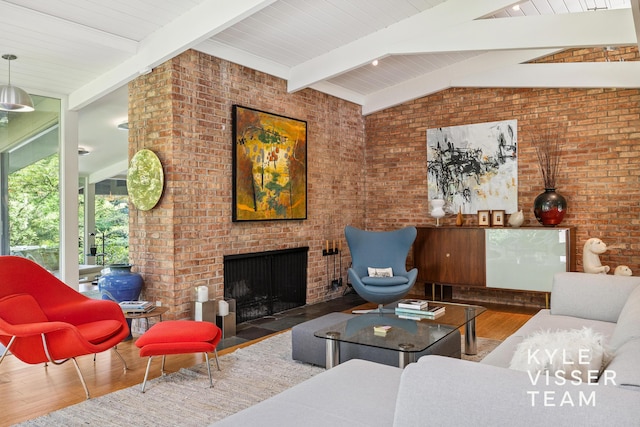 130 Robinwood Ave SE, Grand Rapids, MI 49506 - living area with wood finished floors, a fireplace, and brick wall