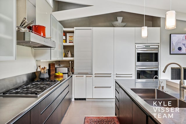 130 Robinwood Ave SE, Grand Rapids, MI 49506 - kitchen featuring appliances with stainless steel finishes, dark brown cabinetry, modern cabinets, light tile patterned floors, and white cabinets