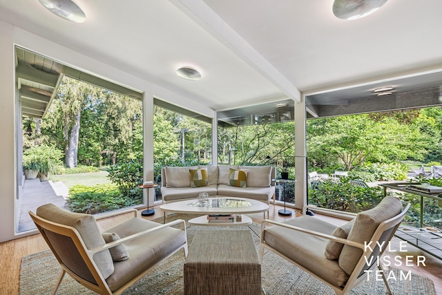 130 Robinwood Ave SE, Grand Rapids, MI 49506 - sunroom featuring an outdoor hangout area and beam ceiling