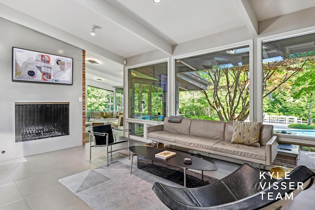 130 Robinwood Ave SE, Grand Rapids, MI 49506 - tiled living area featuring beamed ceiling and a fireplace