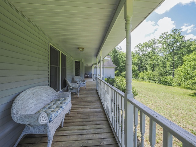 626 Skocelas Rd N, Manistee, MI 49660 - wooden deck with a lawn