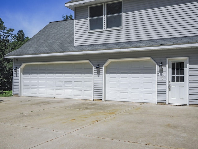 626 Skocelas Rd N, Manistee, MI 49660 - garage with driveway